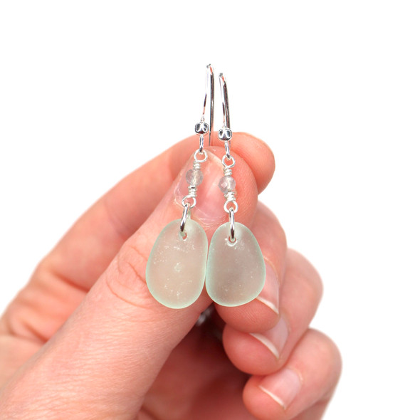 Seafoam Sea Glass and Labradorite Gemstone Drop Earrings on model for color reference.