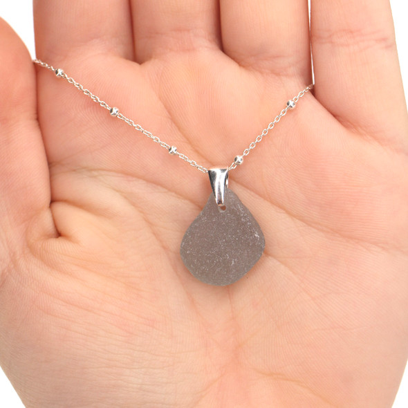 Gray Smooth Drop Sea Glass Pinch Necklace on model for color reference. 