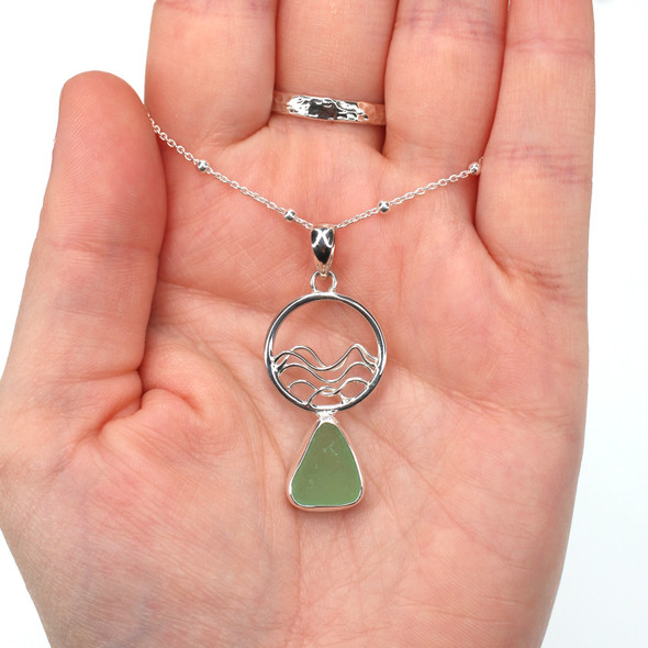 Seafoam Bright Sea Glass Ocean Wave Necklace on model for color reference.