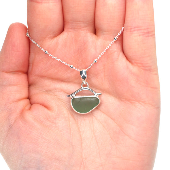 Olive Sea Glass Wave Necklace on model for color reference. 