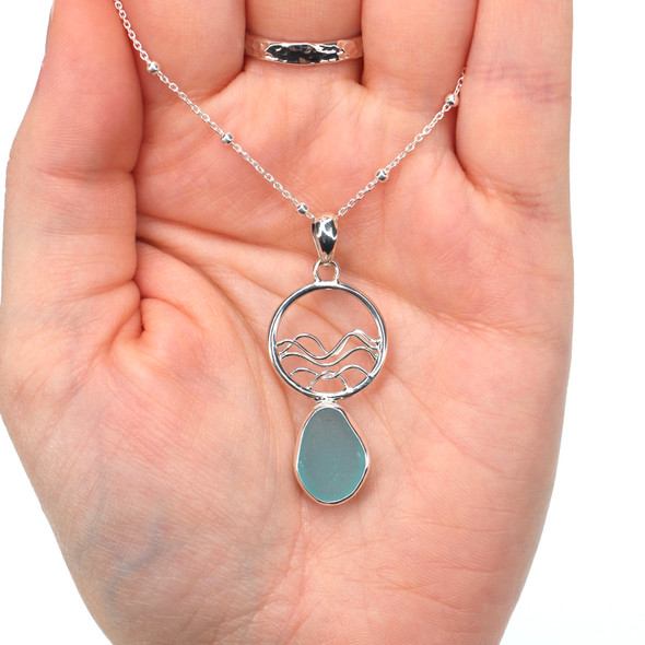 Aqua Sea Glass Ocean Wave Necklace on model for color reference.