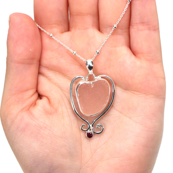 Pink Sea Glass and Ruby Swirl Heart Necklace on model for color reference.