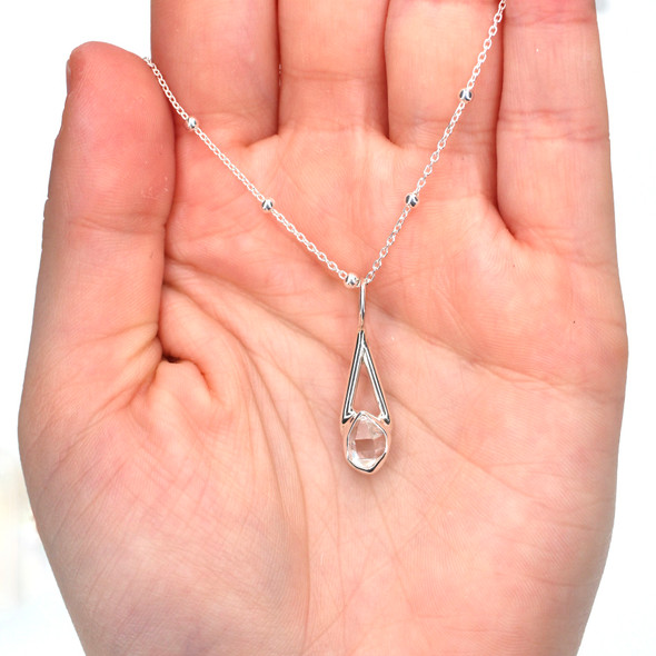 Herkimer Diamond Lunar Drop Charm on model for color reference.