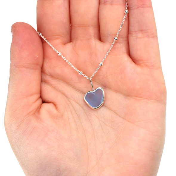 Cornflower Plush Sea Glass Bezel Wrap Charm on model for color reference.