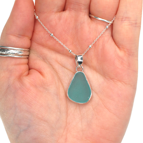 Aqua Brilliant Sea Glass Single Bezel Necklace on model for color reference. 