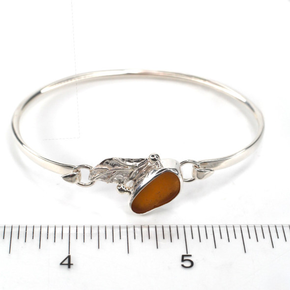 Amber Warm Sea Glass and Silver Leaf Bracelet on ruler for size reference. Amber Warm Sea Glass and Silver Leaf Bracelet on ruler for size reference.