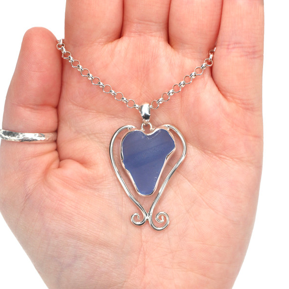 Cornflower Heart Sea Glass Bottle Lip Swirl Necklace on model for color reference.