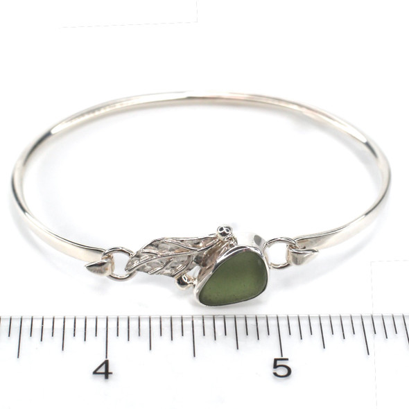 Olive Triangle Sea Glass and Silver Leaf Bracelet on ruler for size reference. Olive Triangle Sea Glass and Silver Leaf Bracelet on ruler for size reference.