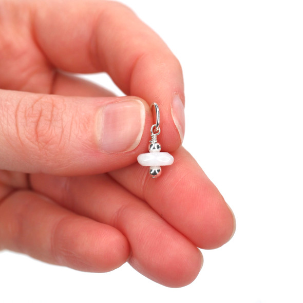 Blue Peruvian Opal Charm held to the light