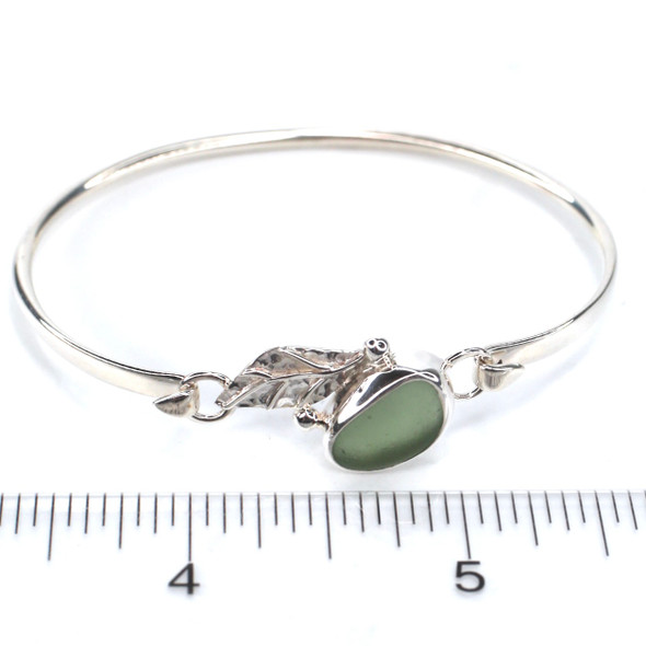 Olive Smooth Sea Glass and Silver Leaf Bracelet on ruler for size reference. Olive Smooth Sea Glass and Silver Leaf Bracelet on ruler for size reference.