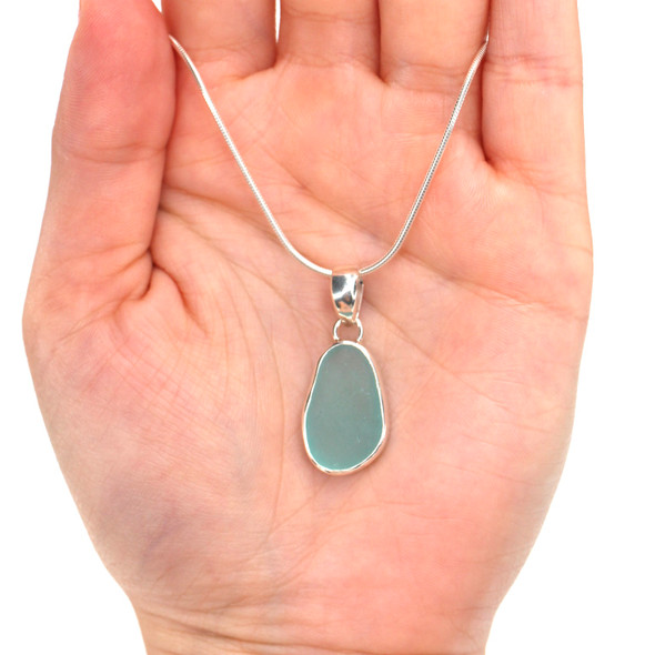Aqua Sea Glass Single Bezel Necklace on model for color Aqua Sea Glass Single Bezel Necklace on model for color