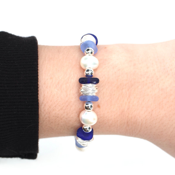 Cobalt and Cornflower Sea Glass and Pearl Beaded Bracelet on model for color reference.