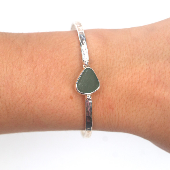 Olive Sea Glass Beaded Hammered Cuff Bracelet on model for color reference. Olive Sea Glass Beaded Hammered Cuff Bracelet on model for color reference.