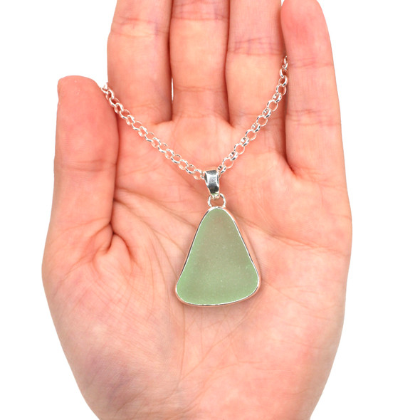Seafoam Sea Glass Single Bezel Necklace on model for color reference. Seafoam Sea Glass Single Bezel Necklace on model for color reference.