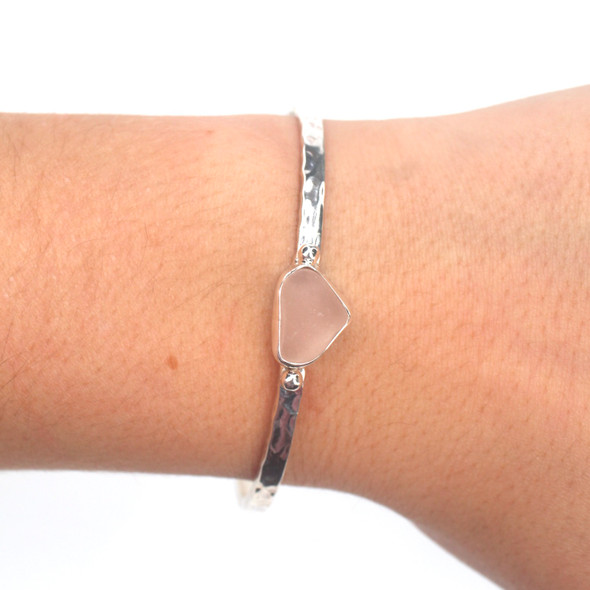Pink Sea Glass Beaded Hammered Cuff Bracelet on model for color reference. Pink Sea Glass Beaded Hammered Cuff Bracelet on model for color reference.