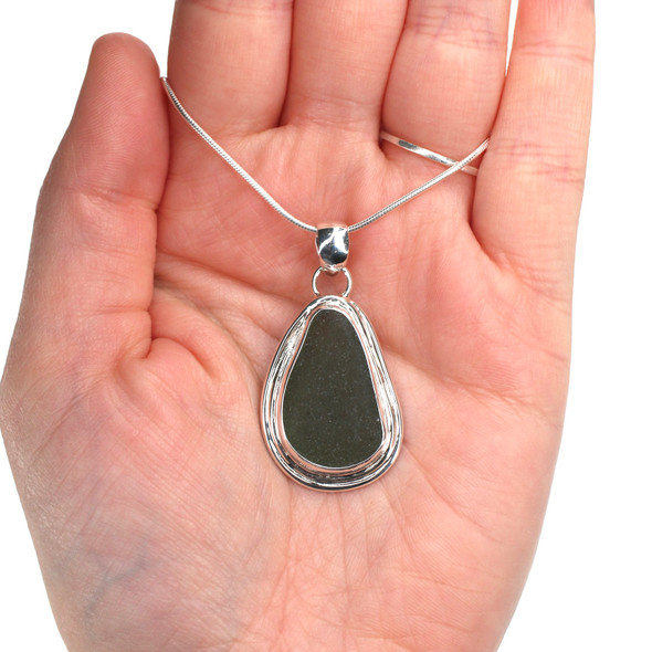 Olive Smooth Sea Glass Nest Necklace on model for color reference. Olive Smooth Sea Glass Nest Necklace on model for color reference.