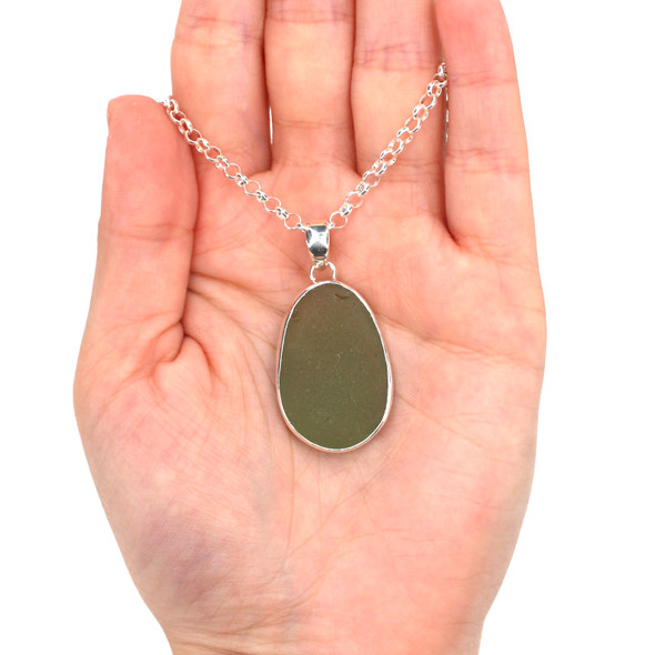 Olive Sea Glass Single Bezel Necklace on model for color reference. Olive Sea Glass Single Bezel Necklace on model for color reference.
