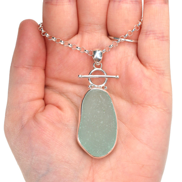 Seafoam Sea Glass Toggle Necklace on model for color reference. Seafoam Sea Glass Toggle Necklace on model for color reference.
