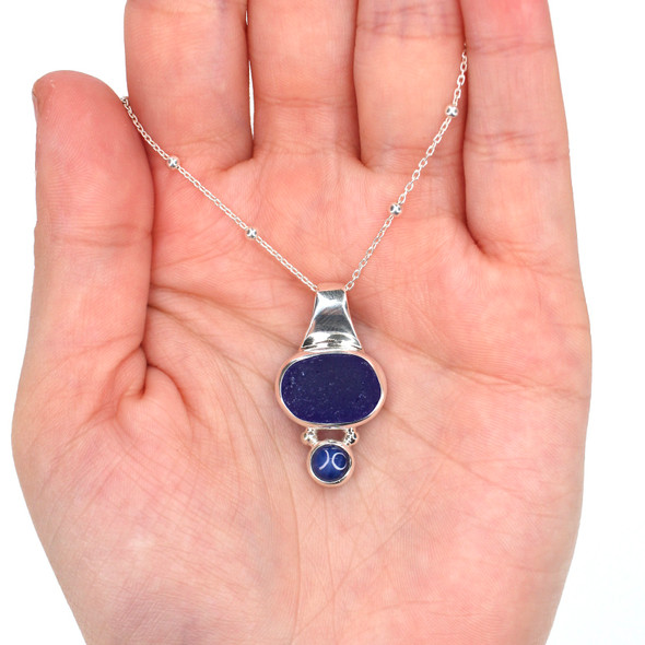 Cobalt Round Sea Glass and Star Sapphire Slide Necklace on model for color reference. Cobalt Round Sea Glass and Star Sapphire Slide Necklace on model for color reference.