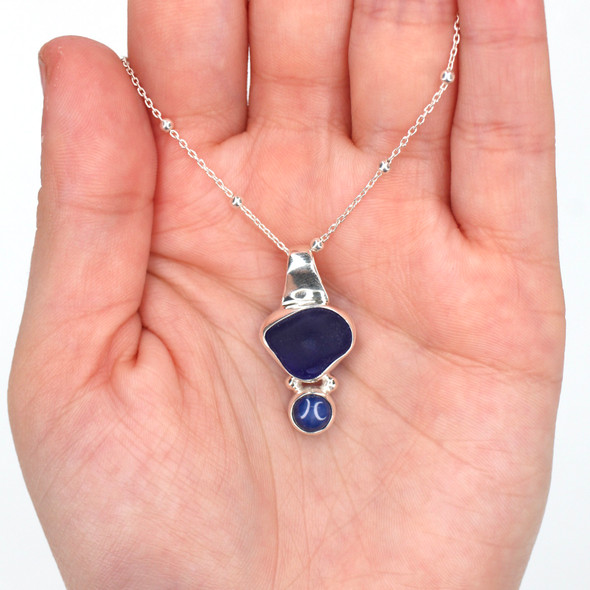 Cobalt Sea Glass and Star Sapphire Slide Necklace on model for color reference. Cobalt Sea Glass and Star Sapphire Slide Necklace on model for color reference.