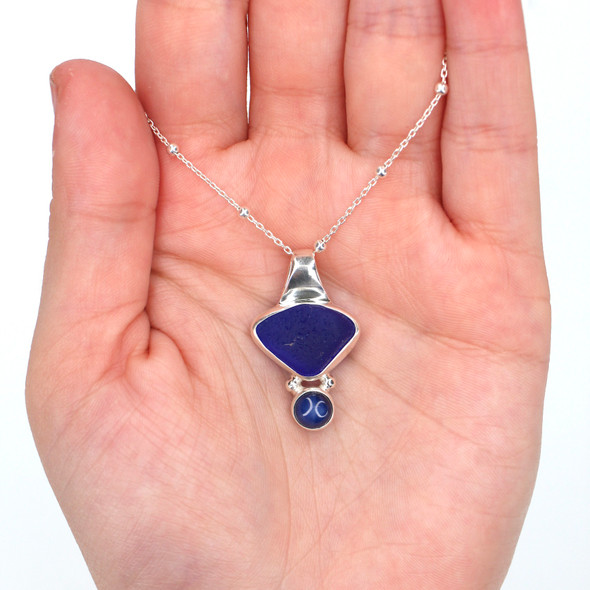 Cobalt Triangle Sea Glass and Star Sapphire Slide Necklace on model for color reference. Cobalt Triangle Sea Glass and Star Sapphire Slide Necklace on model for color reference.