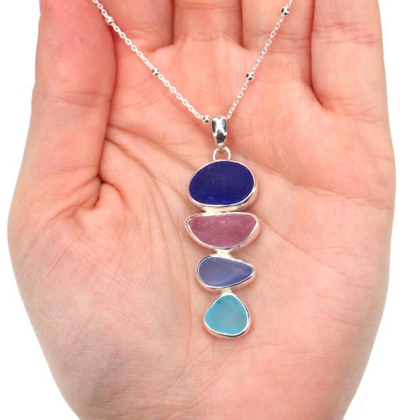 Turquoise Berry Blues Sea Glass 4 Stone Elongated Rainbow Necklace on model for color reference. 
