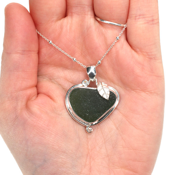 Olive Sea Glass Little Leaf Necklace on model for color reference. Olive Sea Glass Little Leaf Necklace on model for color reference.