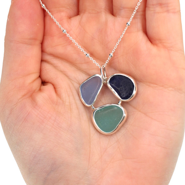 Beautiful Blues Sea Glass Circle of Life Necklace on model for color reference.