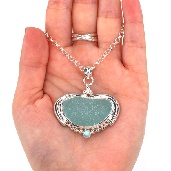 Aqua Sea Glass and Larimar Ocean Empress Necklace on model for color reference. Aqua Sea Glass and Larimar Ocean Empress Necklace on model for color reference.