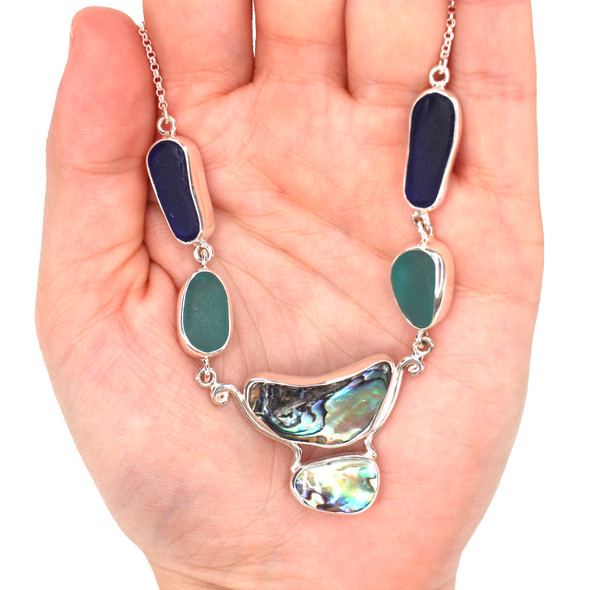 Aqua and Cobalt Sea Glass and Abalone Necklace on model for color reference. Aqua and Cobalt Sea Glass and Abalone Necklace on model for color reference.