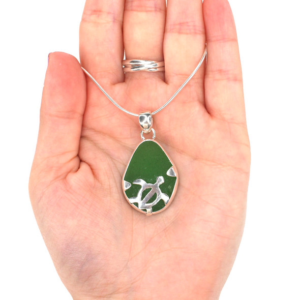 Green Sea Glass Swimming Turtle Necklace on model for color reference.
Green Sea Glass Swimming Turtle Necklace on model for color reference.