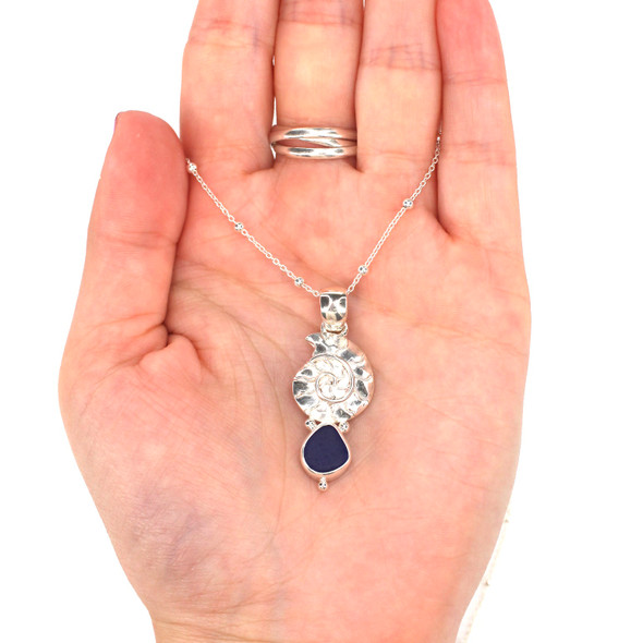 Cobalt Midnight Sea Glass and Silver Nautilus Necklace on model for color reference.
Cobalt Midnight Sea Glass and Silver Nautilus Necklace on model for color reference.
