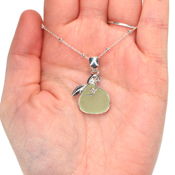 Seafoam UV Sea Glass Pumpkin Necklace on model for color reference. Seafoam UV Sea Glass Pumpkin Necklace on model for color reference.