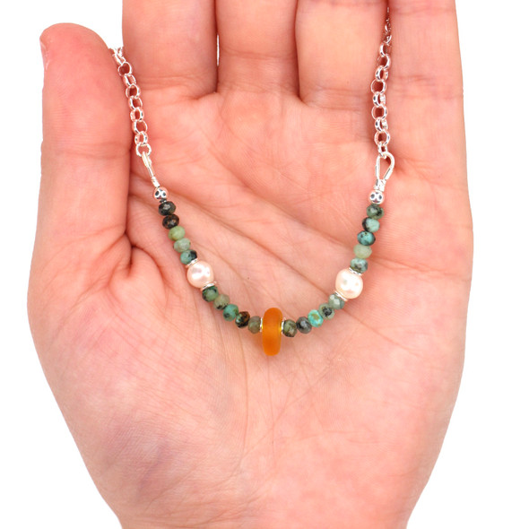 Tangerine Sea Glass Pearl and Turquoise Gemstone Necklace on model for color reference. Tangerine Sea Glass Pearl and Turquoise Gemstone Necklace on model for color reference.