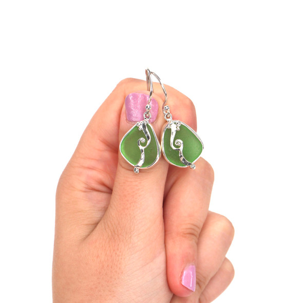 Green Sea Glass Wave Earring on model for color reference.
Green Sea Glass Wave Earring on model for color reference.