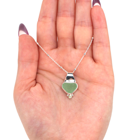 Seafoam Vibrant Sea Glass and Peridot Petite Slide Necklace on model for color reference. Seafoam Vibrant Sea Glass and Peridot Petite Slide Necklace on model for color reference.