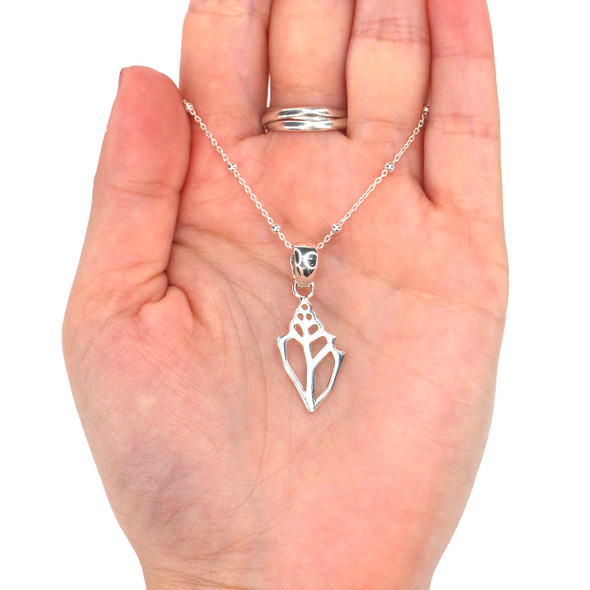 Sterling Silver Conch Shell Necklace on model for color reference. 

