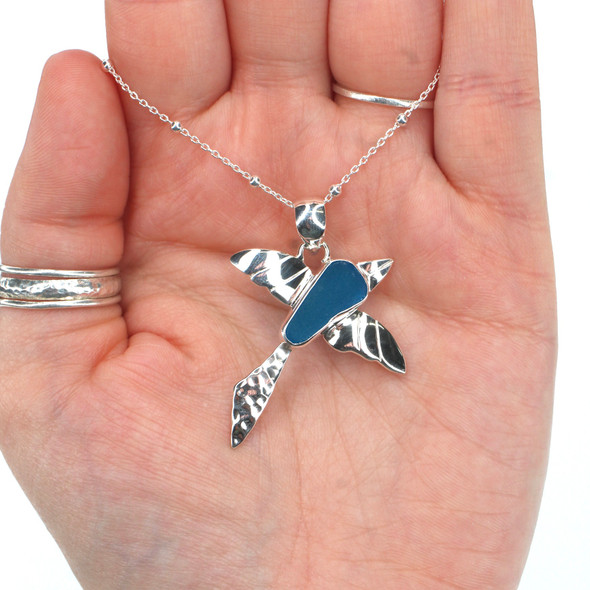 Turquoise Sea Glass Bird in Flight Necklace in hand for color reference Turquoise Sea Glass Bird in Flight Necklace in hand for color reference