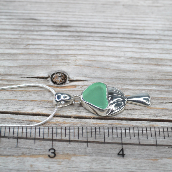 Seafoam Bright Sea Glass Mushroom Necklace on ruler