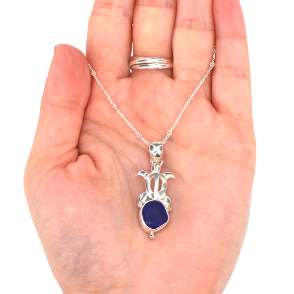 Cobalt Midnight Sea Glass Turtle Necklace on model for color reference. 