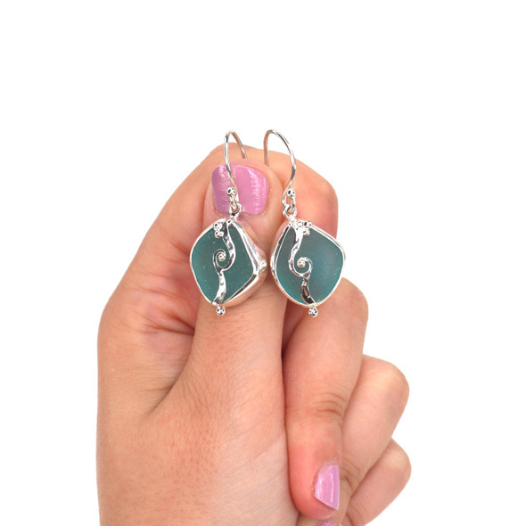 Aqua Sea Glass Wave Earring on model for color reference. 

