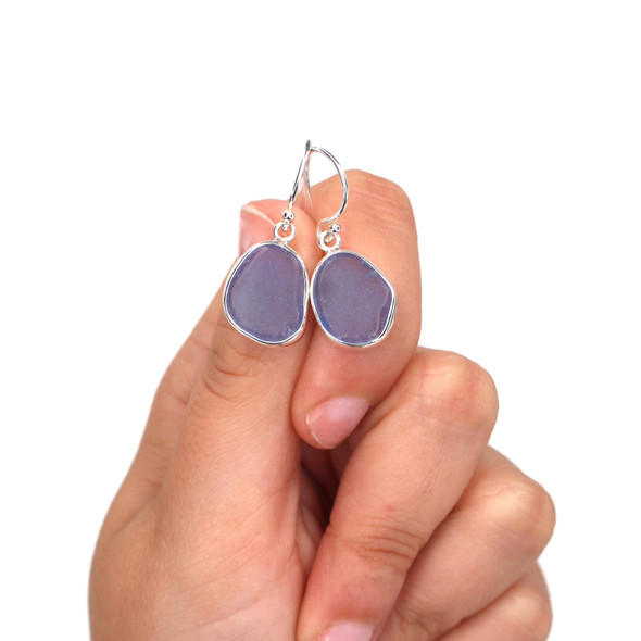 Cornflower Sea Glass Single Bezel Earring on model for color reference. Cornflower Sea Glass Single Bezel Earring on model for color reference.