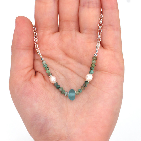 Aqua Sea Glass Pearl and Turquoise Gemstone Necklace on model for color reference. Aqua Sea Glass Pearl and Turquoise Gemstone Necklace on model for color reference.