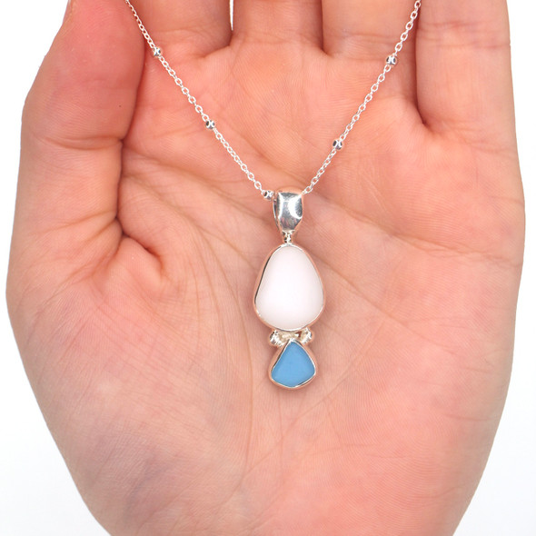 Turquoise and White Milk Glass Sea Glass Double Necklace on model for color reference. Turquoise and White Milk Glass Sea Glass Double Necklace on model for color reference.