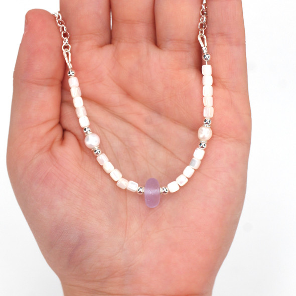 Purple Bright Sea Glass Pearl and Mother of Pearl Pearl Necklace on model for color reference. Purple Bright Sea Glass Pearl and Mother of Pearl Pearl Necklace on model for color reference.