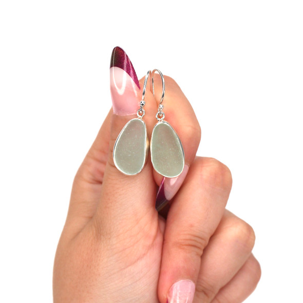 Seafoam Smooth Sea Glass Single Bezel Set Earrings on model for color reference. Seafoam Smooth Sea Glass Single Bezel Set Earrings on model for color reference.