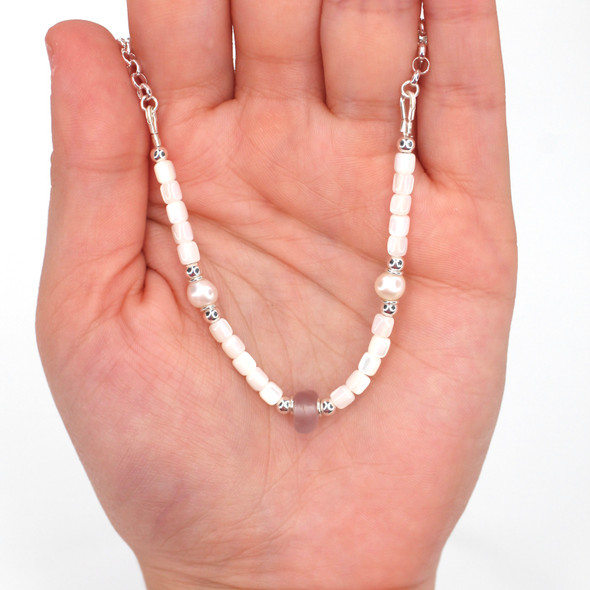 Lavender Sea Glass Sea Glass Pearl and Mother of Pearl Pearl Necklace on model for color reference. Lavender Sea Glass Sea Glass Pearl and Mother of Pearl Pearl Necklace on model for color reference.