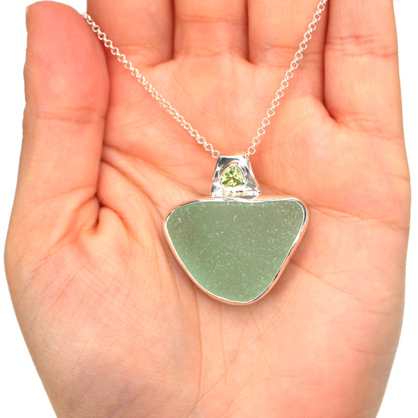 Seafoam Sea Glass and Peridot Single Bezel Necklace on model for color reference.