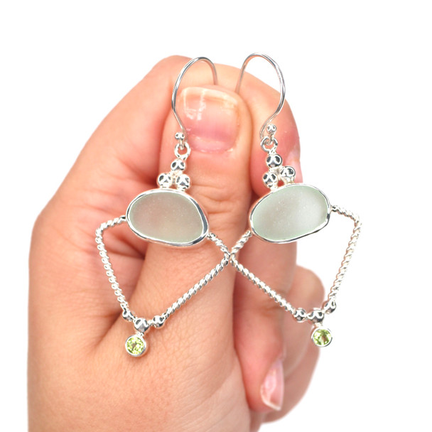 Seafoam Sea Glass and Peridot Trinity Halo Earrings on model for color reference.