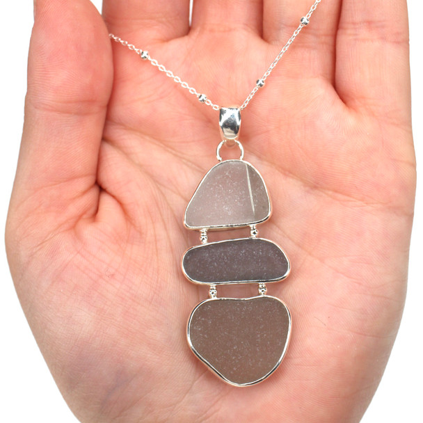 Gray Sea Glass Three Tier Necklace on model for color reference.